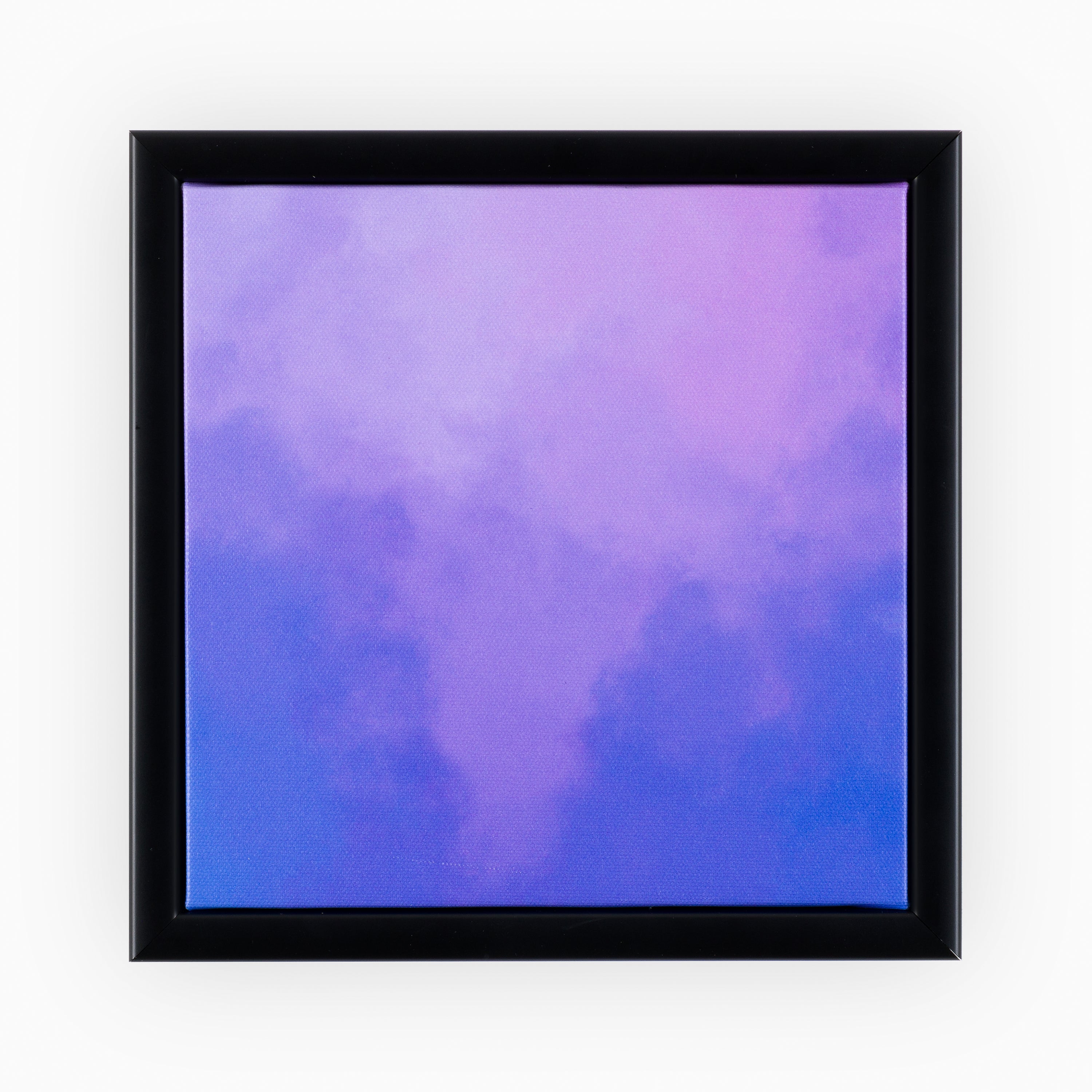 Luxurious canvas encased in a sophisticated black frame, featuring a smooth lavender, purple to royal blue gradient, creating a calming swirl effect that exudes modern elegance.