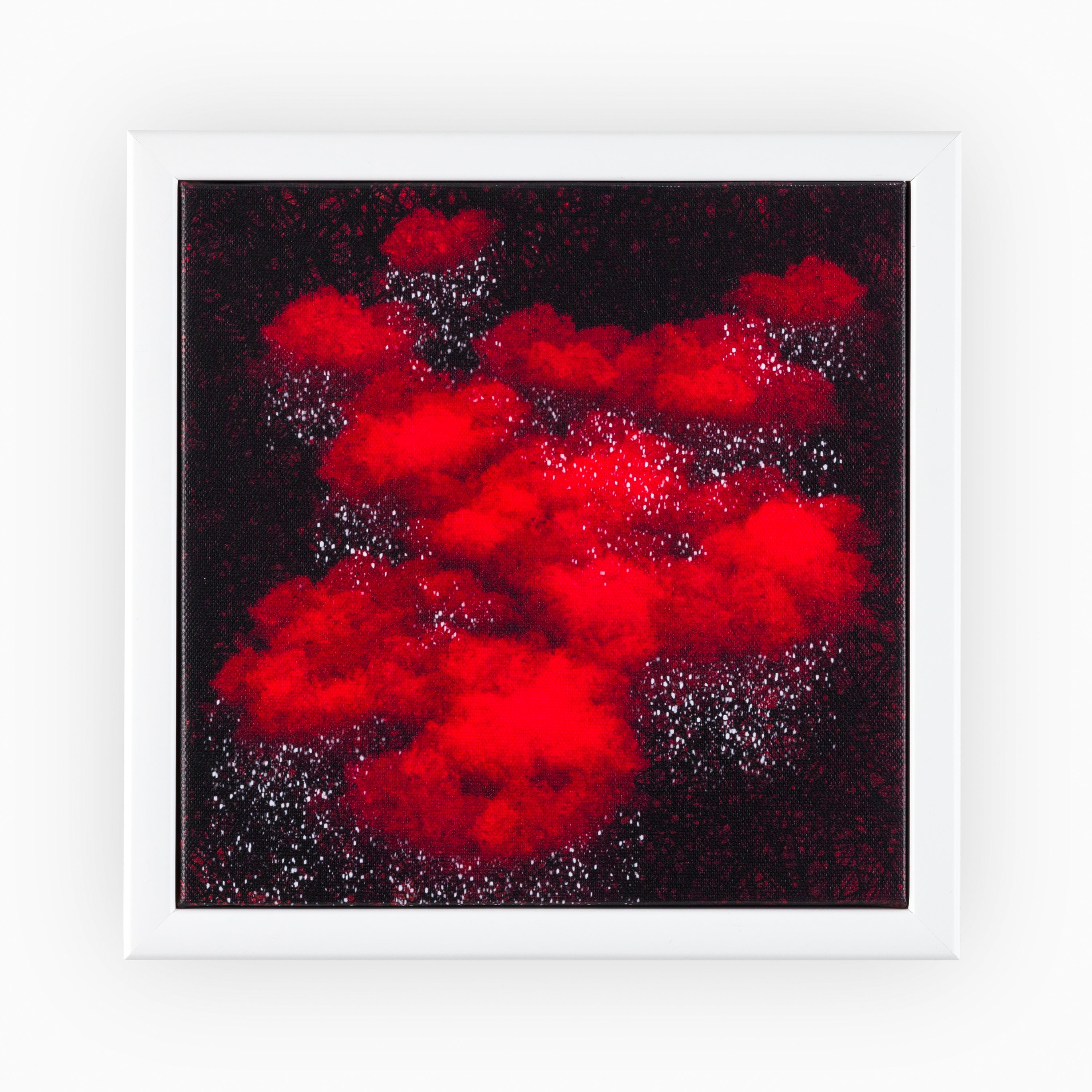 Deluxe canvas piece with a white frame, presenting a vibrant astral display of red nebula-like formations on a star-filled night sky, offering a bold statement in any opulent space.